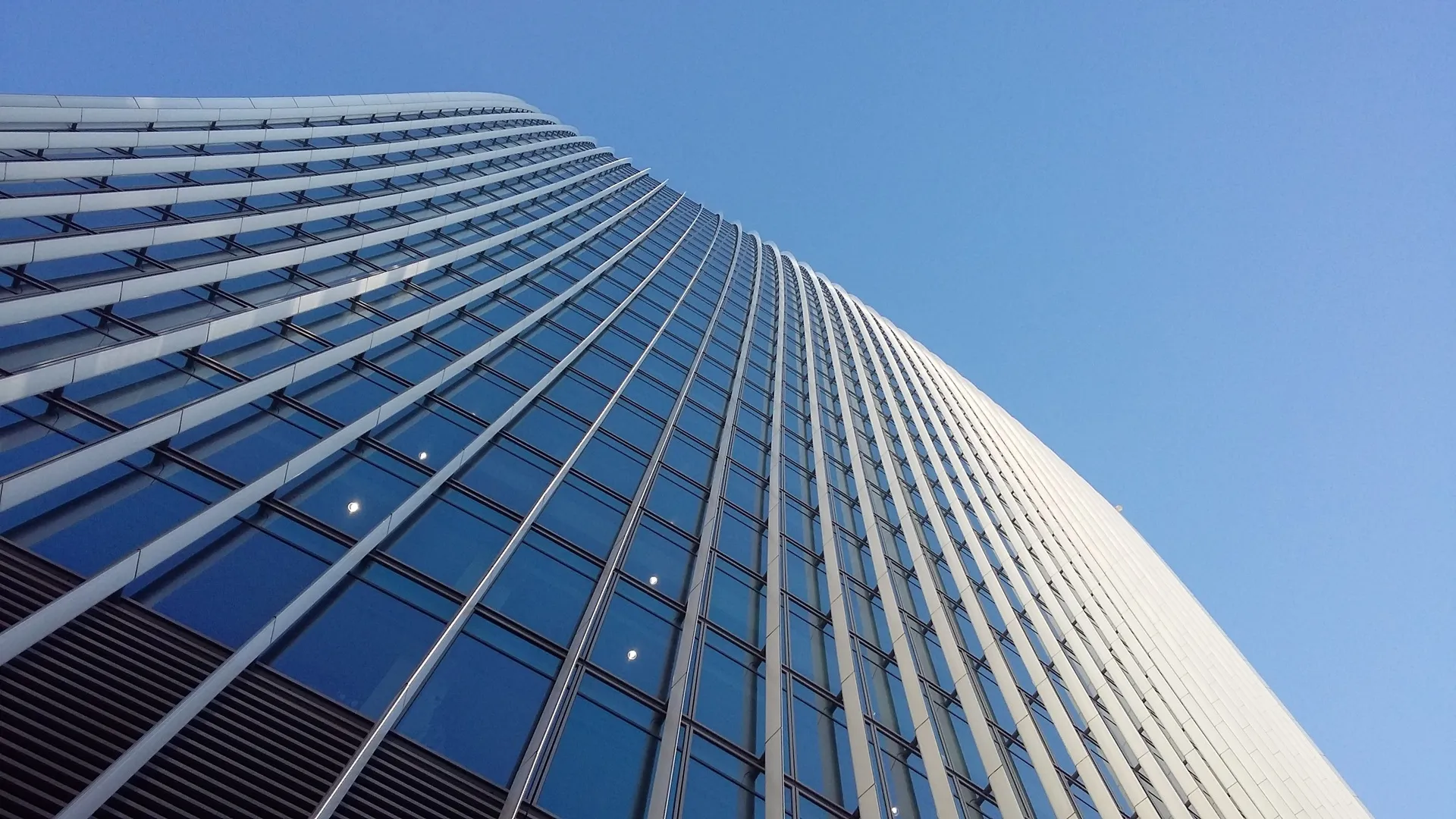 Professional commercial window cleaning on modern glass building in London